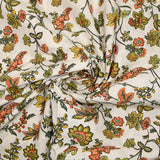 Cotton poplin digitally printed with coral and olive Indian flowers on an ecru background