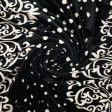 Short-cut velvet jersey with ornamental stripe and ivory polka dot print, black background