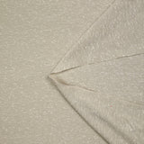 Jersey de polyester moucheté blanc fond grège