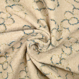 Lainage bouclette fantaisie fleurs fond beige