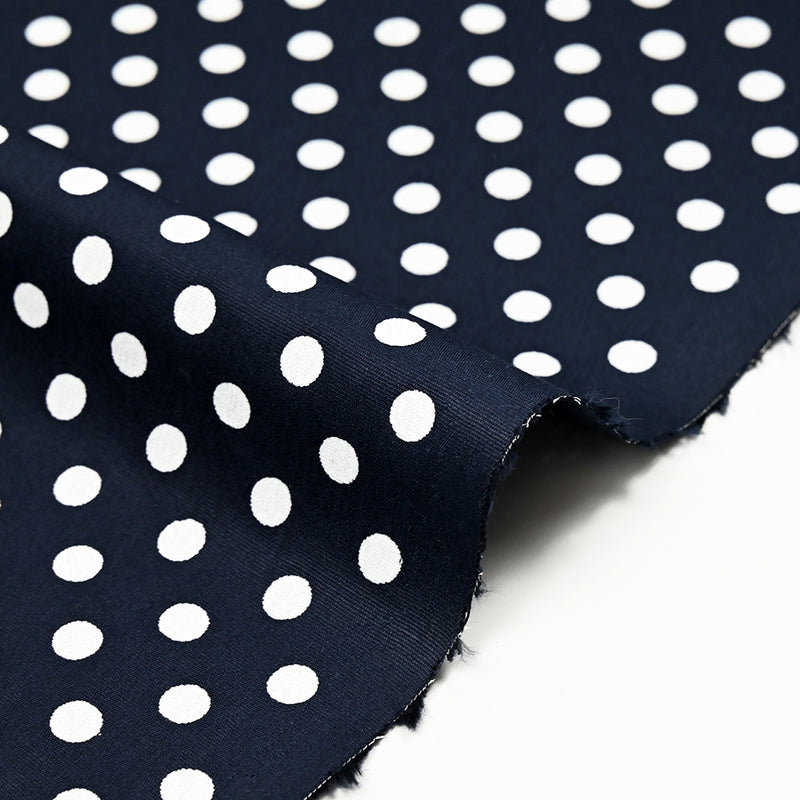 Coton imprimé pois 8mm fond bleu marine