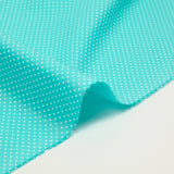 Coton imprimé pois 1mm fond bleu turquoise