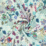 Viscose imprimée explosion florale turquoise fond blanc