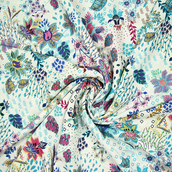 Viscose imprimée explosion florale turquoise fond blanc