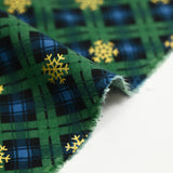 Flanelle de coton imprimée tartan vert sapin et flocons dorés