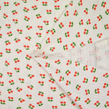Jersey pointelle coton imprimé cerise fond blanc cassé