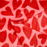 Polaire doudou imprimée coeur rouge fond rose