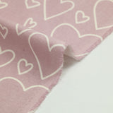 Flanelle imprimée cœurs fond mauve