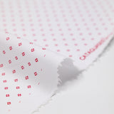 Coton imprimé signe géométrique rouge fond blanc