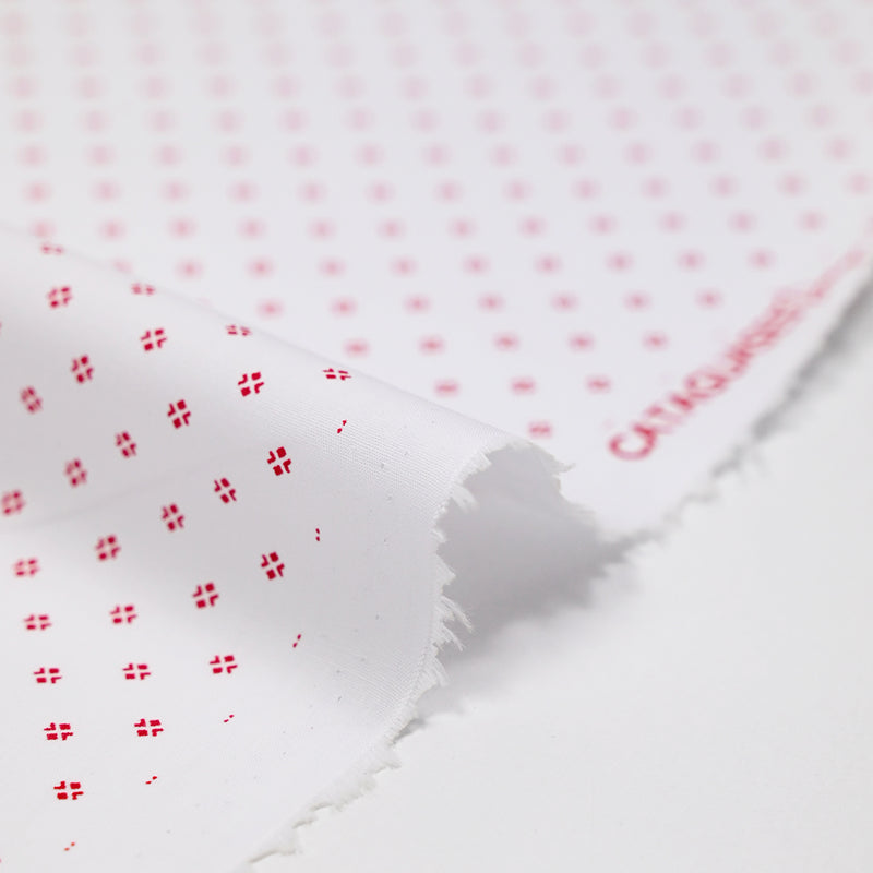 Coton imprimé signe géométrique rouge fond blanc