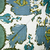 Coton imprimé ikat vert et bleu fond blanc