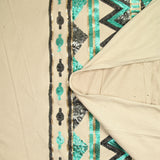 Suede jersey with embroidered base in water green and gray sequin, sand background