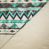 Suede jersey with embroidered base in water green and gray sequin, sand background