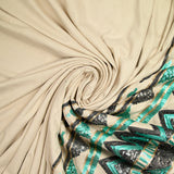 Suede jersey with embroidered base in water green and gray sequin, sand background