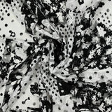 Dentelle polyester imprimée fantaisie noir sur fond blanc