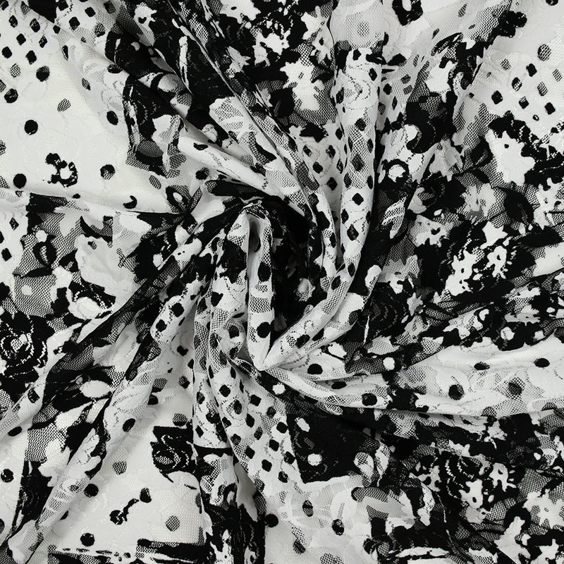 Dentelle polyester imprimée fantaisie noir sur fond blanc