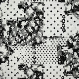 Dentelle polyester imprimée fantaisie noir sur fond blanc