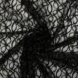 Dentelle polyester fleurs dorées brodées lurex noir