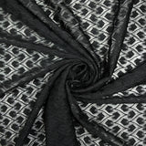 Maille dentelle fleurs stylisées fond noir