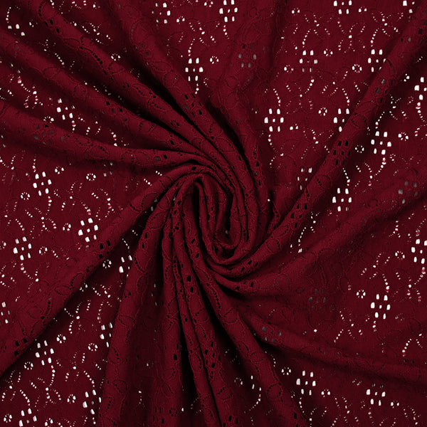 Maille polyester ajourée fleurs fond bordeaux