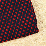 Maille polyviscose floquée pois rouge fond bleu marine