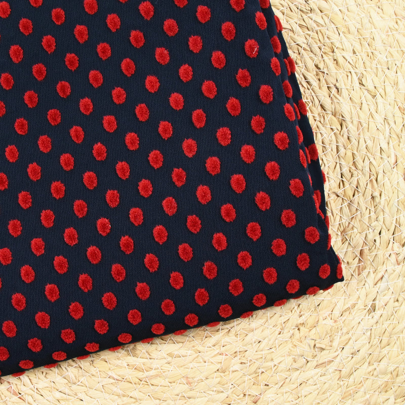 Maille polyviscose floquée pois rouge fond bleu marine