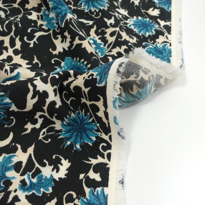 Maille polyester imprimé boussole bleu fond noir