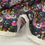 Mousseline crinkle imprimée lurex prairie fleurie magenta fond noir