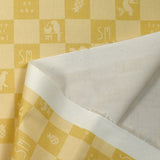 Sergé de coton imprimé damier tropical jaune pâle et moutarde