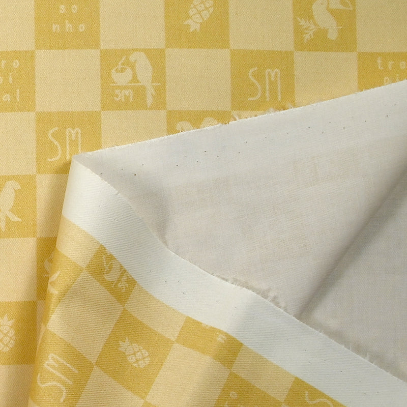 Sergé de coton imprimé damier tropical jaune pâle et moutarde