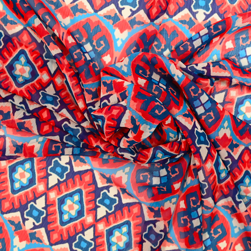 Mousseline polyester imprimée timbres rouges fond bleu