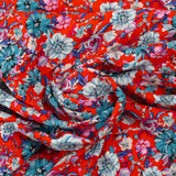 Viscose imprimée fleurs turquoise fond rouge