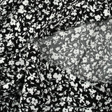 Crépon viscose rayé lurex argent fleurs fond noir