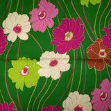 Twill de viscose imprimé en fleurs anis et fuchsia fond vert prairie