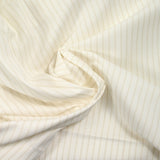 Popeline de coton rayée camel fond blanc