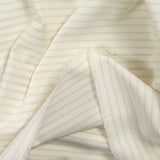 Popeline de coton rayée camel fond blanc