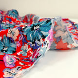 Viscose imprimée fleurs turquoise fond rouge