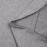 Jersey de coton moucheté coloré fond gris