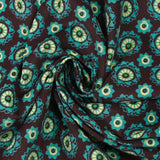 Velours de coton côtelé imprimé rosaces turquoise fond marron