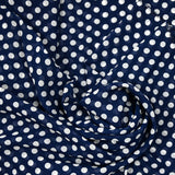 Mousseline de polyester imprimée pois blanc fond marine