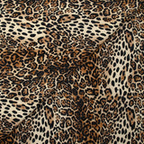 Gabardine de coton élasthanne léopard sauvage fond marron et écru