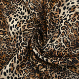 Gabardine de coton élasthanne léopard sauvage fond marron et écru