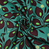 Velours de coton côtelé imprimé feuillage aubergine fond turquoise