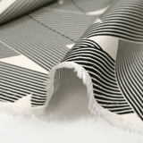 Fine viscose satin with black and off-white intertwined star print