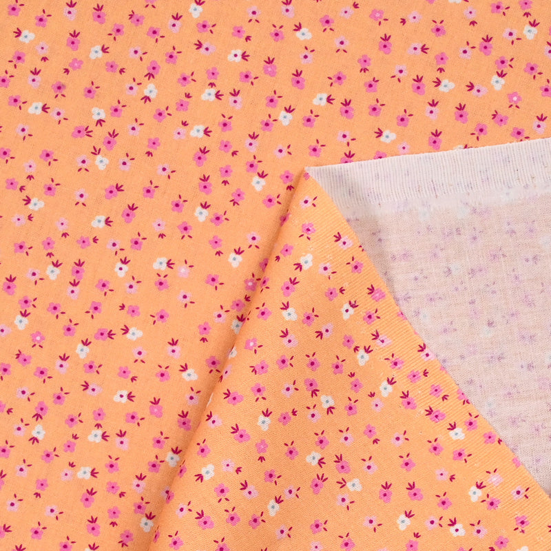 Cotton printed mini flowers salmon background
