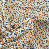 Coton imprimé fleurs de Chantale ciel et moutarde