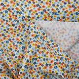 Coton imprimé fleurs de Chantale ciel et moutarde