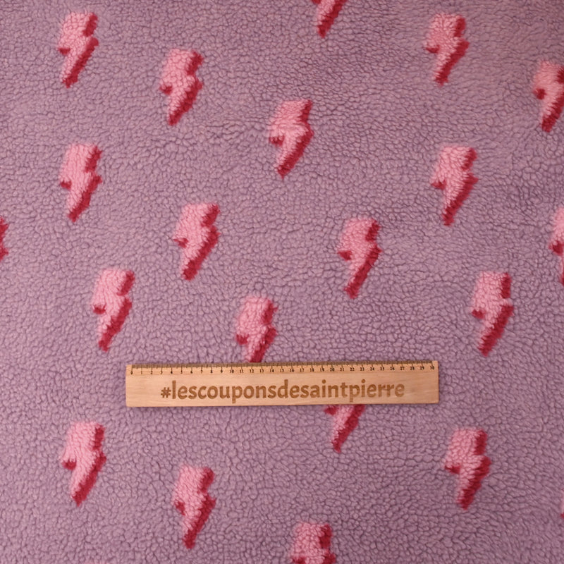 Fausse fourrure sherpa éclairs fond lilas