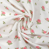 Coton imprimé les fleurs de Lou rose fond blanc