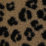 Fausse fourrure sherpa léopard noir fond marron